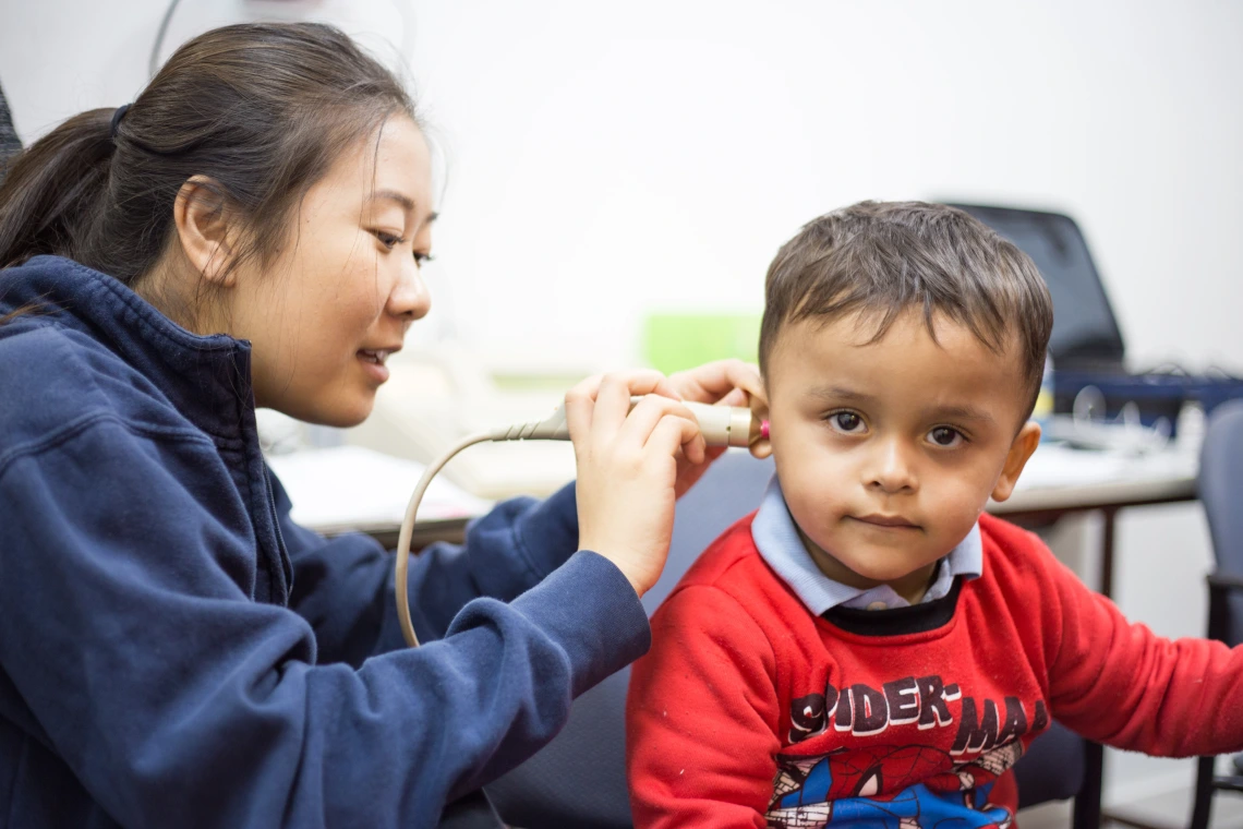 Graduate clinician works with a child Graduate clinician works with a child